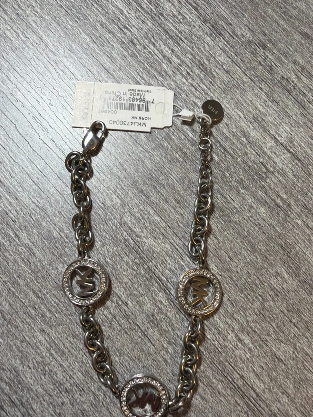 Michael Kors Silver-Tone MK Charm Chain Bracelet with Crystal Rings